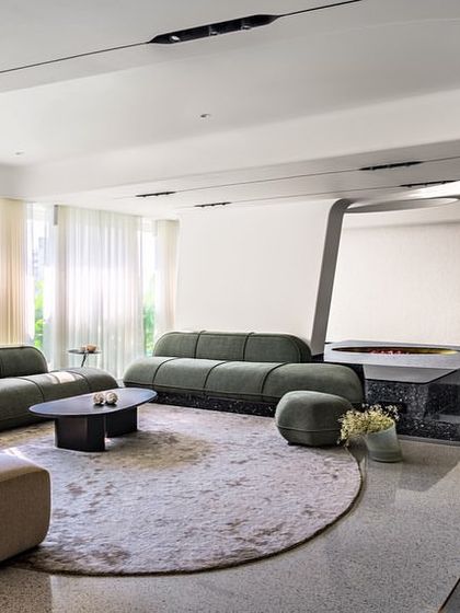 For Apartment 56, we designed the living area as a free-flowing gallery space. We integrated existing structural columns by transforming them into fluid, sculptural divisions that enhance the open plan rather than obstructing it.