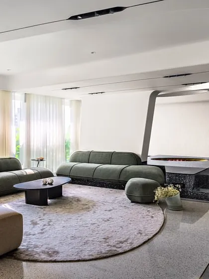 For Apartment 56, we designed the living area as a free-flowing gallery space. We integrated existing structural columns by transforming them into fluid, sculptural divisions that enhance the open plan rather than obstructing it.