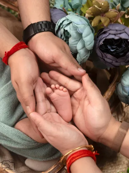 The tiniest feet held in the loving hands of mom and dad. This classic shot is a powerful symbol of family and love.
