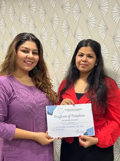 Here is Falguni receiving her certificate for the 20-Day Basic to Intermediate Nail Course. This program builds a strong foundation and introduces more complex techniques.