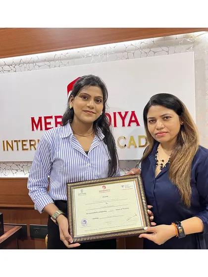 We celebrate every student's success. Here is another graduate receiving her certificate, marking the start of a new chapter.