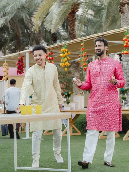 Guests enjoying a game of beer pong at an outdoor event. It's these moments of fun and laughter that people always remember.