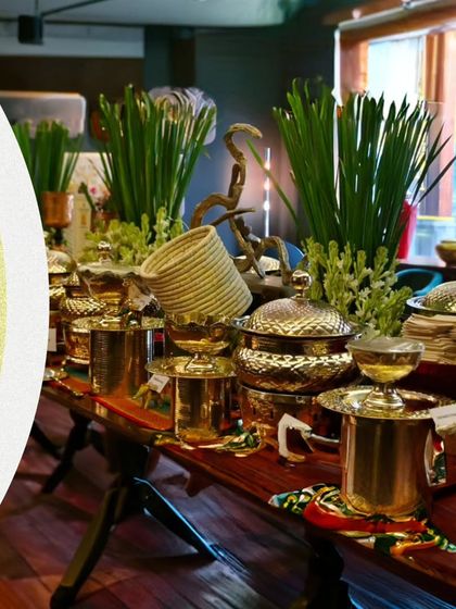 Indulge in a feast fit for the divine. This expansive buffet table, adorned with fresh greenery and traditional serveware, is ready for a Navratri celebration.