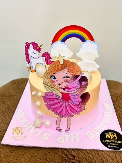 A magical unicorn and princess cake for a 6th birthday celebration. This design combines a cute princess and her unicorn friend with a rainbow and clouds, making it a dream come true for any child.