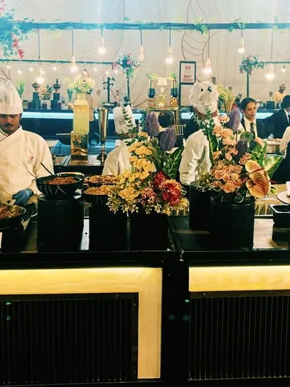 My team of professional chefs at a live counter, ensuring every dish is prepared fresh and served hot. We bring the energy and action of a live kitchen to your wedding or corporate event.