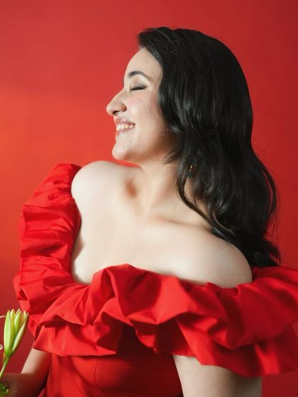 A beautiful, smiling profile shot of Revathi, looking radiant and happy at her screening.