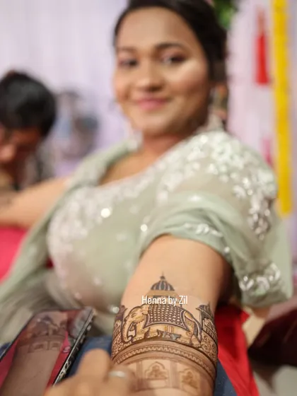 A happy bridesmaid showing off her beautiful armband mehendi. I love creating special designs for the bride's tribe.