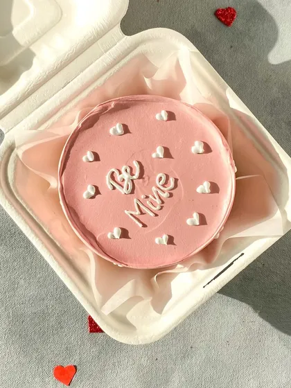 A sweet pink "Be Mine" bento cake with little white clouds. It's a cute and simple way to ask that special question.