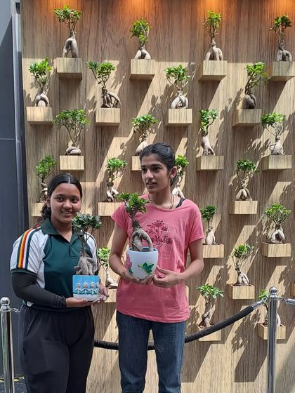 Happy participants at our pot painting and craft activity. We believe in fostering a love for plants and nature within the community through engaging and creative events.