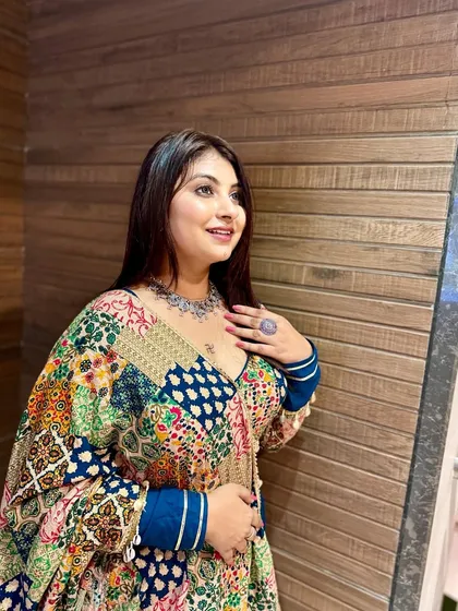 Ready for Navratri 2024! This look features a colorful, patchwork-style lehenga, complemented by soft, natural makeup and silver jewelry.
