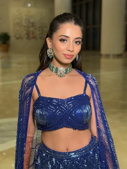 The sister of the bride deserves to shine too. Here, I paired a sharp, clean makeup look with a bold blue lehenga, focusing on a flawless base and soft smokey eyes to create a sophisticated and modern sangeet look.