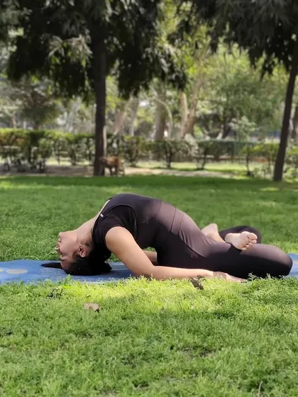 Matsyasana, or Fish Pose, being practiced outdoors. This posture provides a deep stretch to the neck and chest, expanding the rib cage and promoting better breathing, making it a key therapeutic asana for respiratory health.