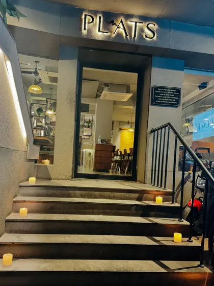 Welcoming you to Plats. The steps to our restaurant lit for Diwali, ready for an evening of celebration.