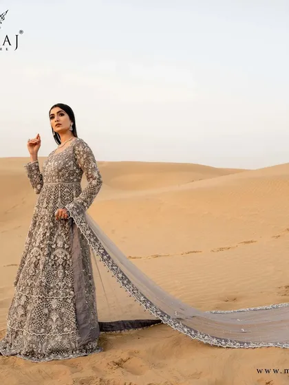My designs are made to create unforgettable moments. This Indo-Western gown, with its dramatic trail and intricate handwork, is set against the majestic desert, showcasing how my couture can transform any landscape into a fairytale.