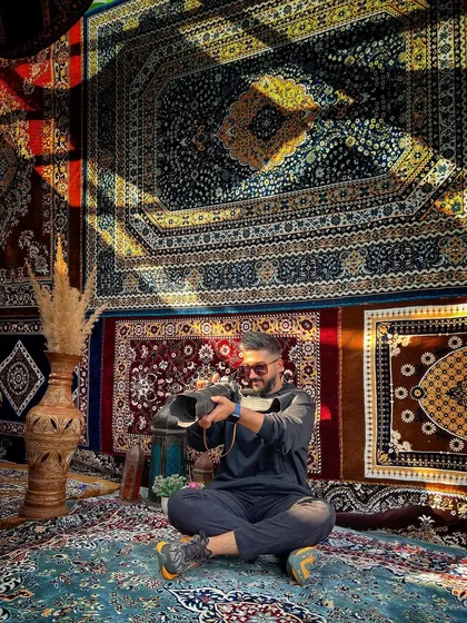 Me at work in a vibrant location filled with beautiful carpets, using the natural light and shadows.
