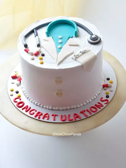 A special cake I designed to celebrate a new doctor. This cake features a doctor's coat and stethoscope, all handcrafted with buttercream and small edible details. It was a Chocolate Truffle with Ferrero Rocher flavour.