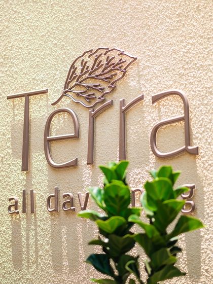 The elegant signage of our all-day dining restaurant, Terra, where we host our diverse range of culinary events and themed brunches.
