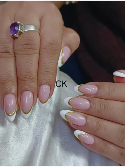 You can never go wrong with a classic French manicure, but I like to add my own twist. Here, I outlined the crisp white tips with a fine line of gold chrome on these almond-shaped extensions. It’s a simple detail that makes the entire look feel more luxurious and modern.