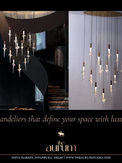 A dramatic cascading chandelier with dagger-like crystal pendants. This fixture is designed for spaces that demand drama and height, such as a grand spiral staircase or a two-story foyer.