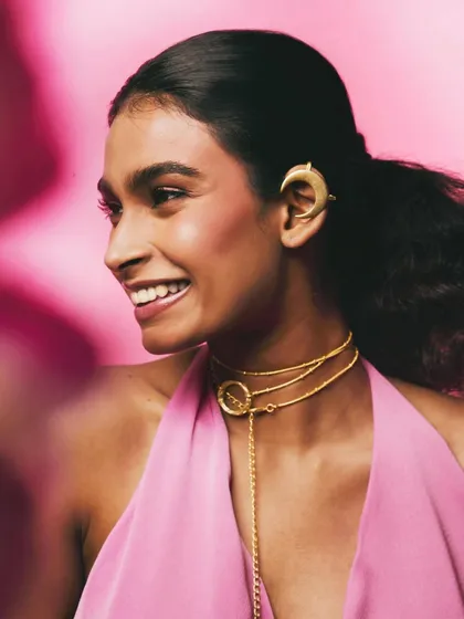 A joyful moment from the Batoki Art campaign, capturing a natural smile. This image connects the handmade jewelry with feelings of happiness and self-expression.