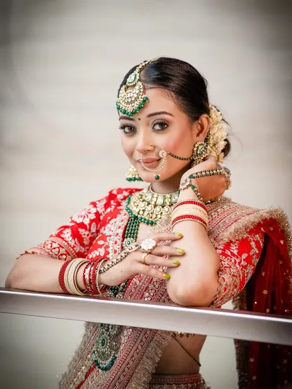 A portrait that captures the bride's gentle strength. The soft, radiant skin and defined eyes are the cornerstones of this classic bridal look.