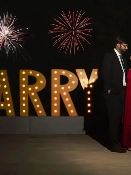 A classic proposal setup with glowing "MARRY ME" letters and fireworks. We help you create and capture those picture-perfect moments that you will cherish forever.