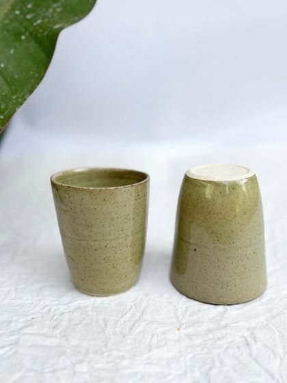 Our Green Celadon tumblers are a handle-free option for your favorite drinks. The tapered shape is comfortable to hold.