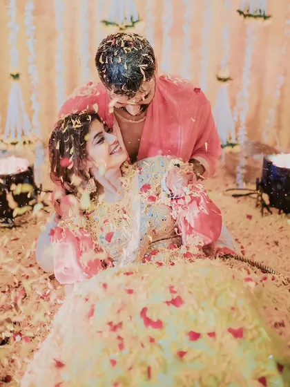 Lost in each other's eyes, even when covered in flowers. These are the moments that truly define a love story.