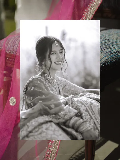 A beautiful black and white candid of the bride's smile, framed creatively to add an artistic touch.