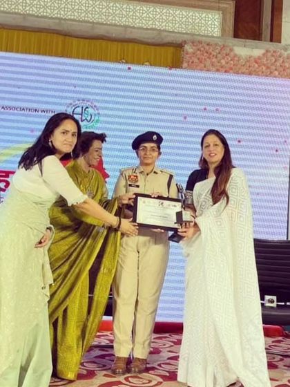 Another shot of me receiving the award. These moments reinforce my commitment to spreading legal awareness.