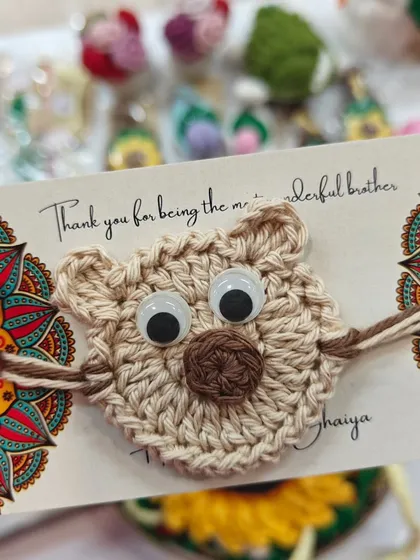One for the little brother. This adorable teddy bear rakhi with googly eyes is sure to bring a smile to his face.
