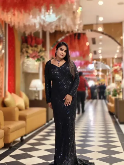 A full-length shot in a stunning black sequin gown. This is my go-to look for high-end award nights and gala dinners, where glamour is a must.