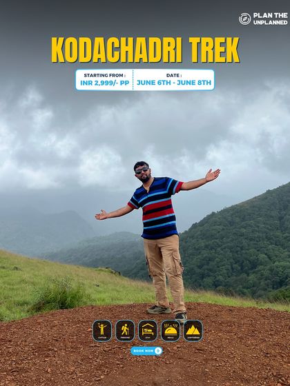 A trekker enjoys the view from the Kodachadri peak.