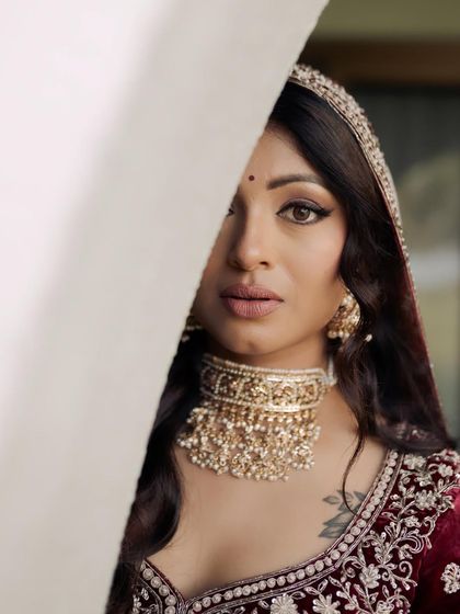 Another artistic portrait of Kavi. The peek-a-boo effect draws attention to her mesmerizing eye makeup and the beautiful contour of her face.