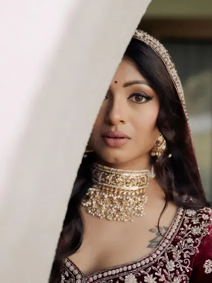 Another artistic portrait of Kavi. The peek-a-boo effect draws attention to her mesmerizing eye makeup and the beautiful contour of her face.
