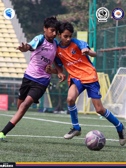 A shoulder to shoulder challenge for the ball. This is the kind of healthy, intense competition that helps players grow.