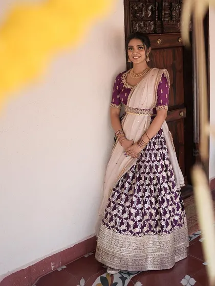 A repeat of the elegant client in her purple brocade lehenga.