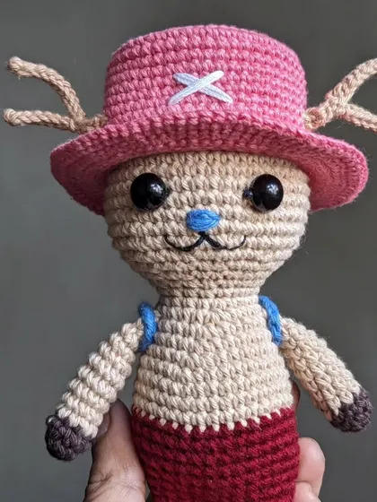 The full Chopper doll from One Piece, held to show its size.