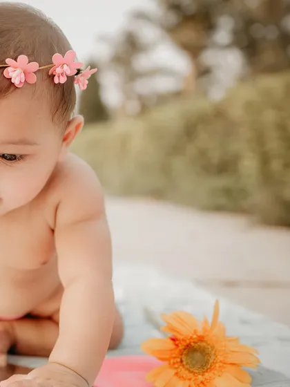 Another beautiful close-up from the first birthday photoshoot. The soft focus on the background makes her sweet expression the absolute center of attention.