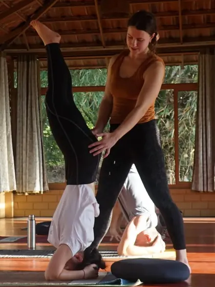 Captions will describe the specific yoga practice shown (e.g., "Practicing Sutra Neti, a traditional yogic cleansing technique," "A Hatha yoga class in our Chakra Hall," "Finding inspiration in our mistakes and using them as a platform for growth.").