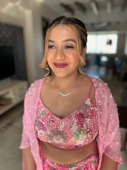 A fun and fresh look for a young client. The makeup is bright and playful, with a focus on her eyes.