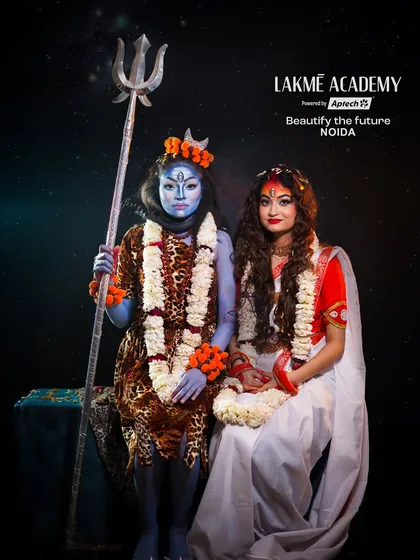 A full-length shot of the Shiva and Parvati characters. This demonstrates the complete styling, from makeup and hair to costumes and props.