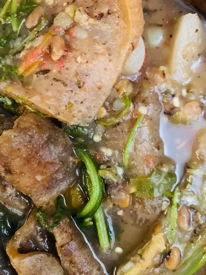 A close-up of the buff skin curry, showing the unique texture of the skin.