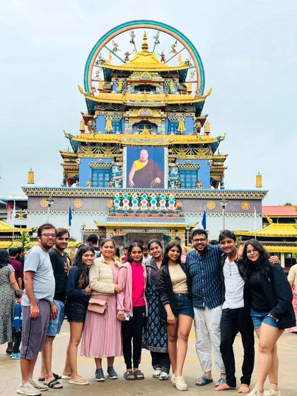 Our tours are also about soaking in the local culture. This moment was captured at the serene and colorful Namdroling Monastery in Coorg, a peaceful contrast to our high-energy treks.
