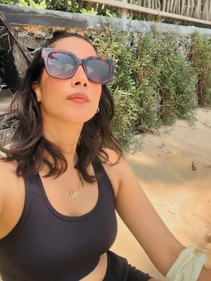 Finding moments of calm and sun on a solo beach day. A healthy lifestyle gives you the energy and confidence to enjoy your own company and explore.