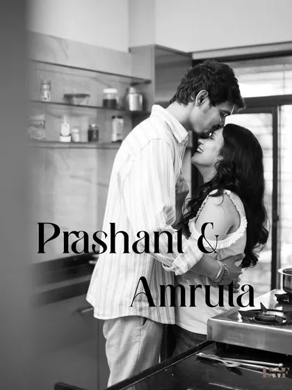 A timeless black and white portrait of the couple in their kitchen. This image focuses purely on the emotion and connection, creating a classic pre-wedding memory.
