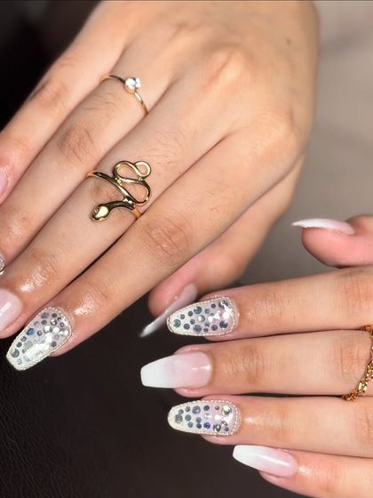 A beautiful shot of these ombré and stone nails, accessorized with elegant rings to show how they complement bridal jewelry.