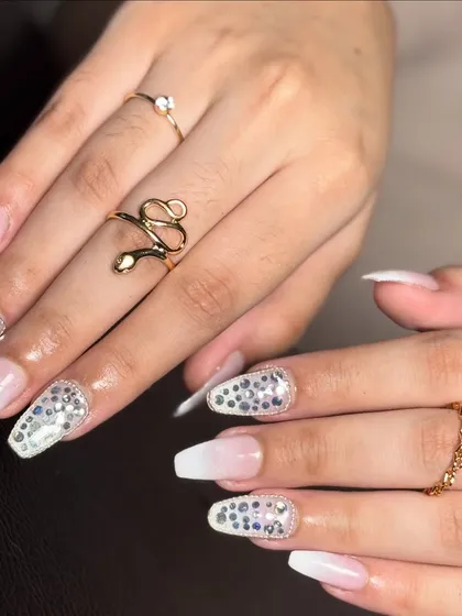 A beautiful shot of these ombré and stone nails, accessorized with elegant rings to show how they complement bridal jewelry.