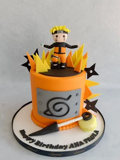 A powerful Naruto-themed cake for Ana Paula's birthday. The cake features a handcrafted Naruto figurine, his signature headband symbol, and fiery sugar decorations.