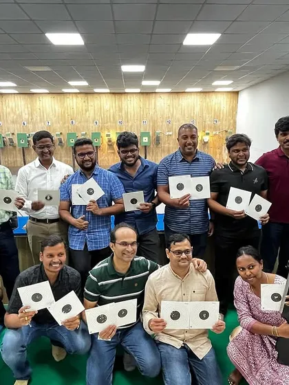 Looking for a unique corporate team building activity? We host groups from various companies for a session of focus, friendly competition, and fun. Here's a team proudly showing their targets after their first shooting experience.